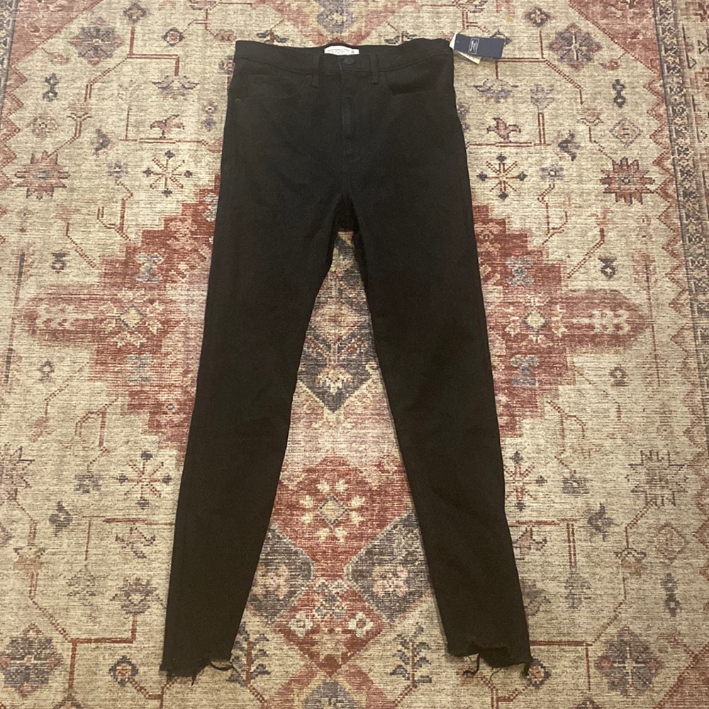 Never worn black Abercrombie jeans. Soft material and are frayed at the bottom